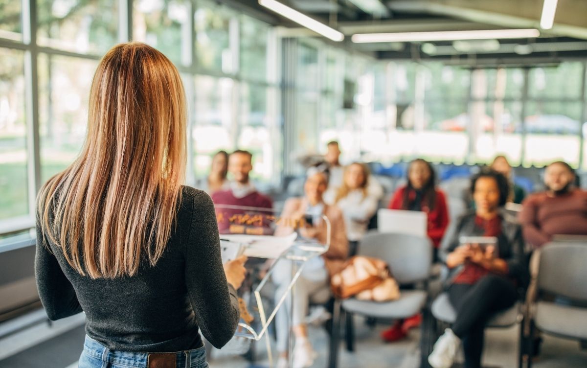 Female presenter giving a presentation