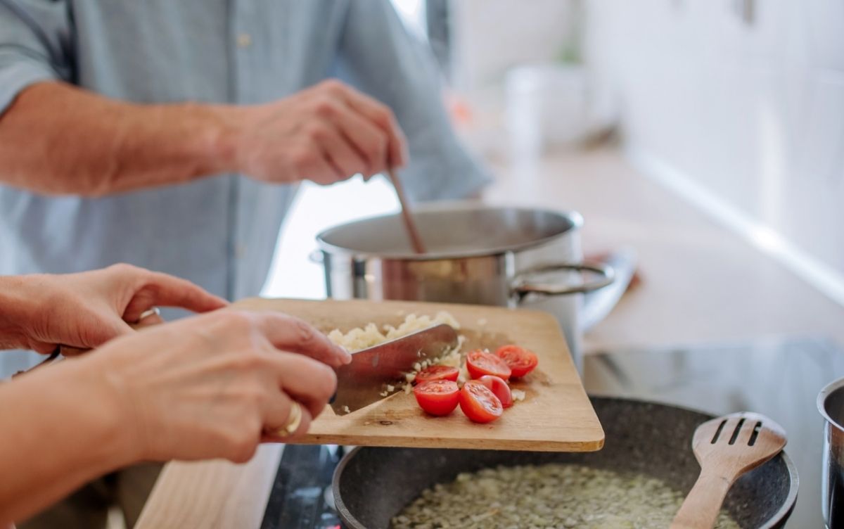 Two people cooking at home